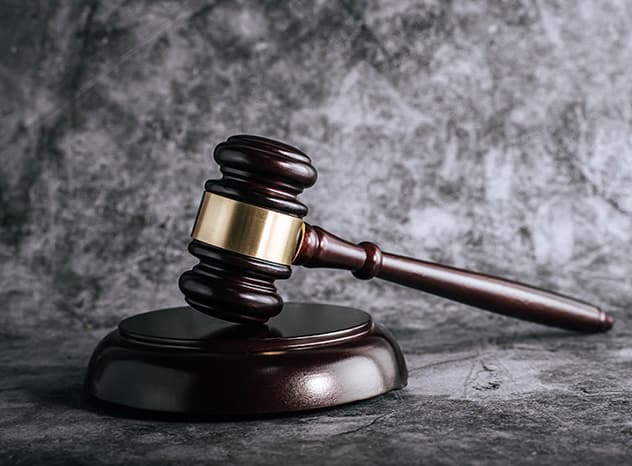 Wooden judge's gavel on a desk