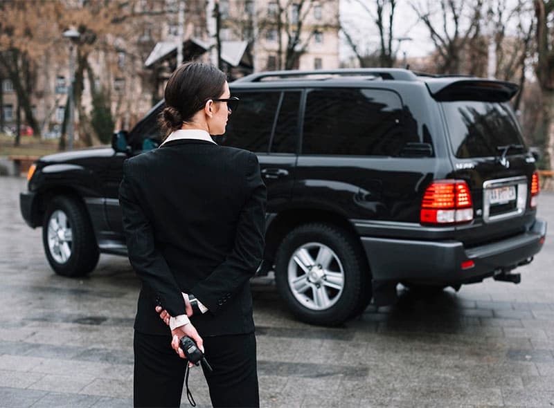 Security officer near a vehicle