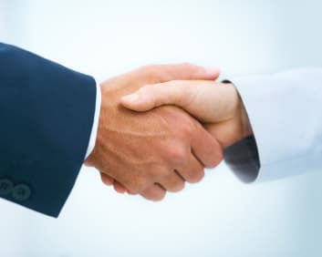 Business professionals shaking hands